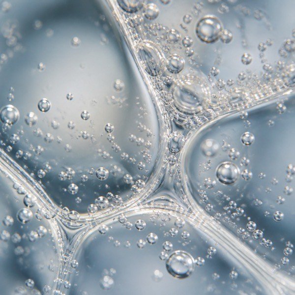 Macro shot of molecular hydrogen bubbles in restructured water