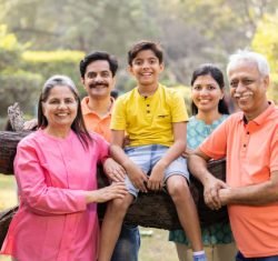 Happy people with senior citizens at park. Family experiencing health transformation through Somawa alkaline water.