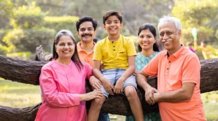 Happy people with senior citizens at park. Family experiencing health transformation through Somawa alkaline water.